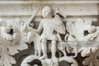 Planet Mars as knight with Aries and Scorpio zodiac signs, ancient medieval relief in Saint Mark Square, Venice