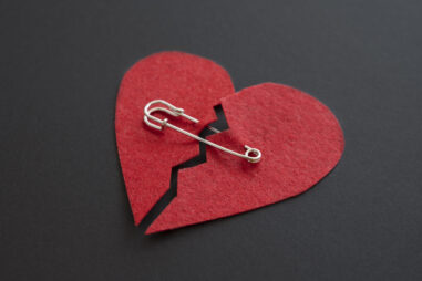 high-angle-broken-heart-with-safety-pin