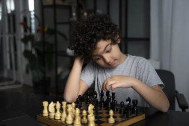 young-kid-playing-chess